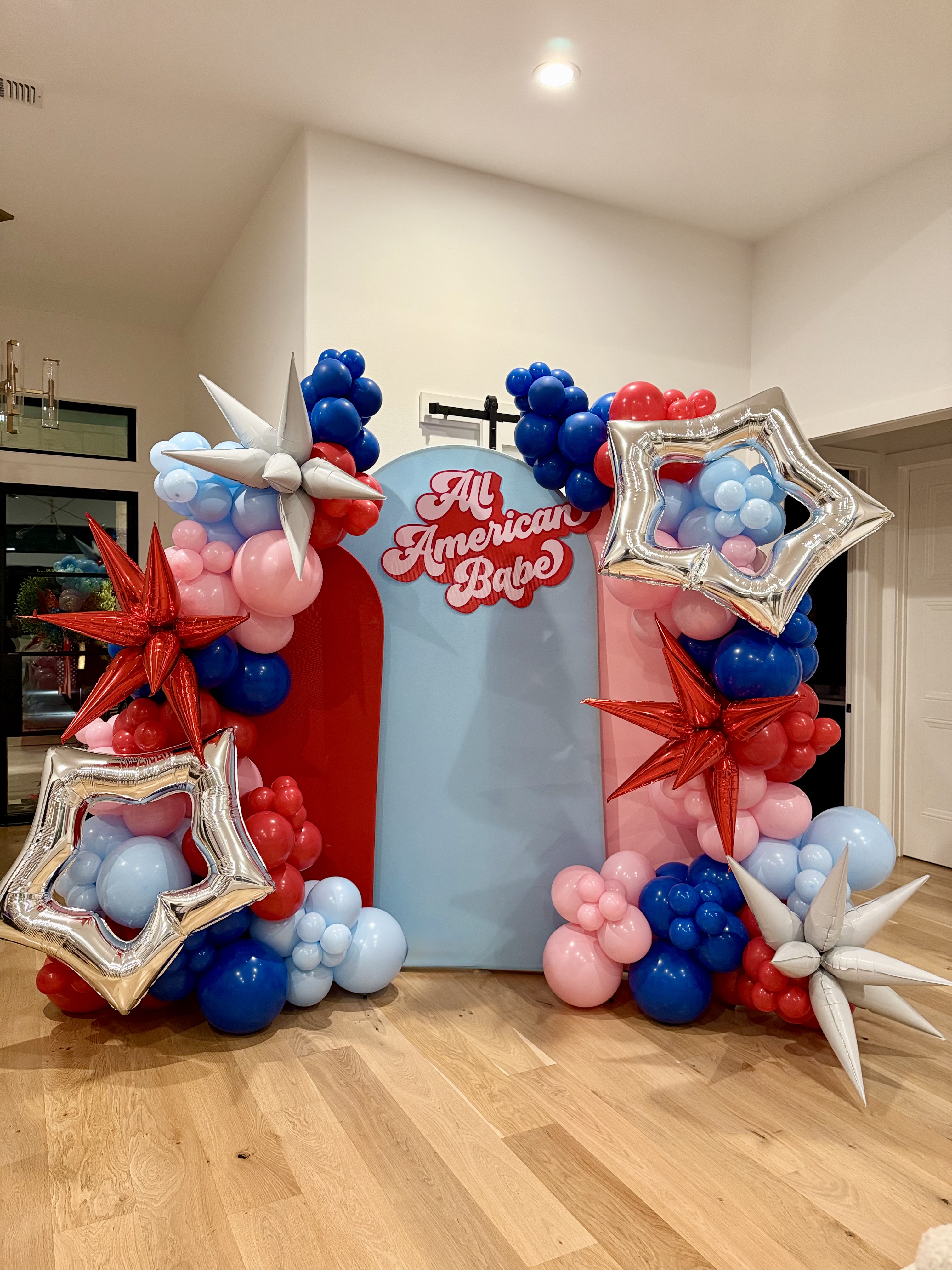 Beautiful pink balloon arch with shimmer backdrop by The Greeting Fairy